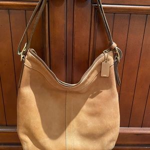 Tan leather Coach purse.